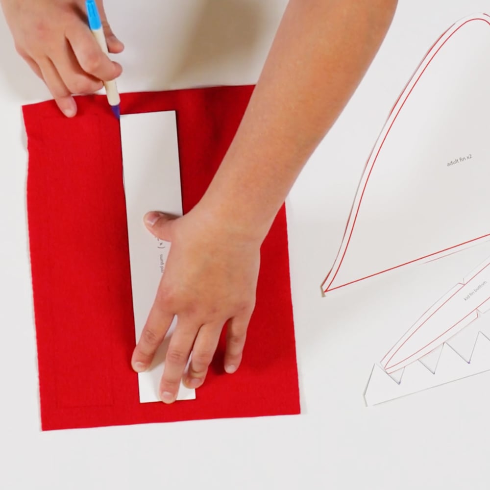 image shows person measuring out shark gums on felt