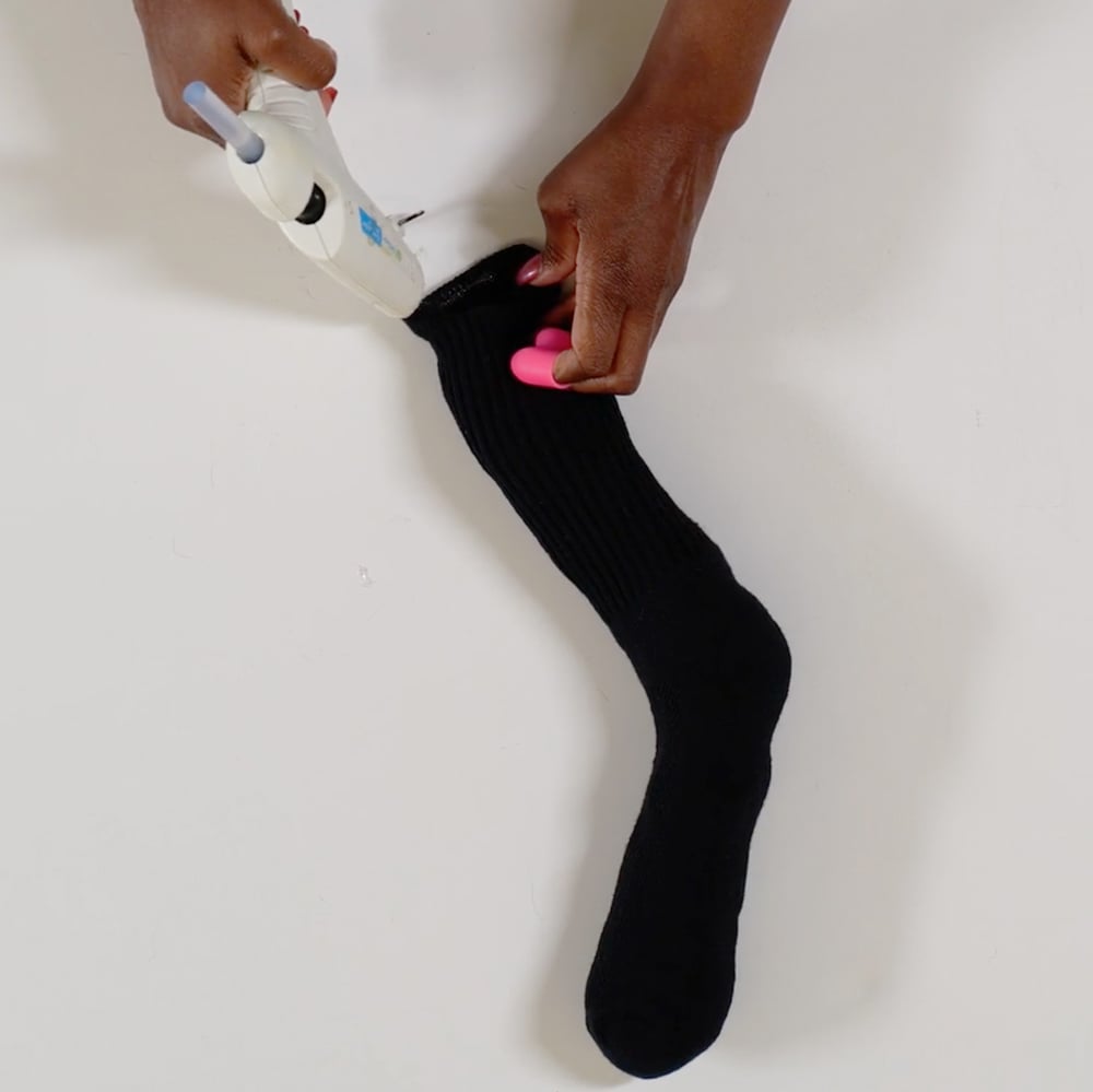 Using hot glue gun to make spider socks