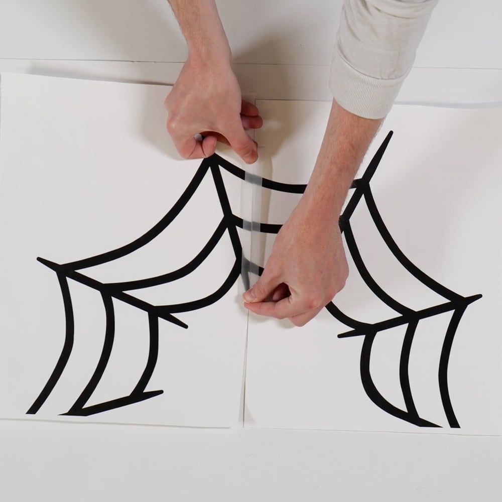 taping template of spider web at the seams